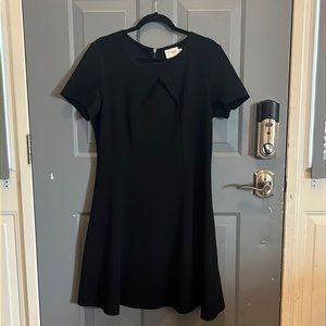 Women’s black shirt-sleeved dress. Size 16